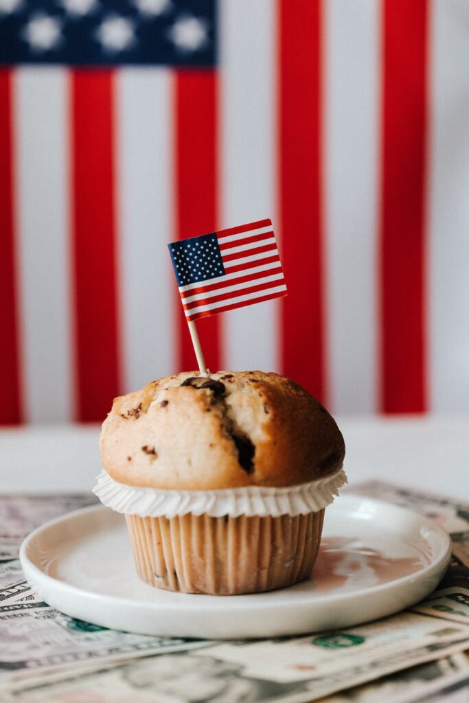 dessert with flag on money against american flag on background