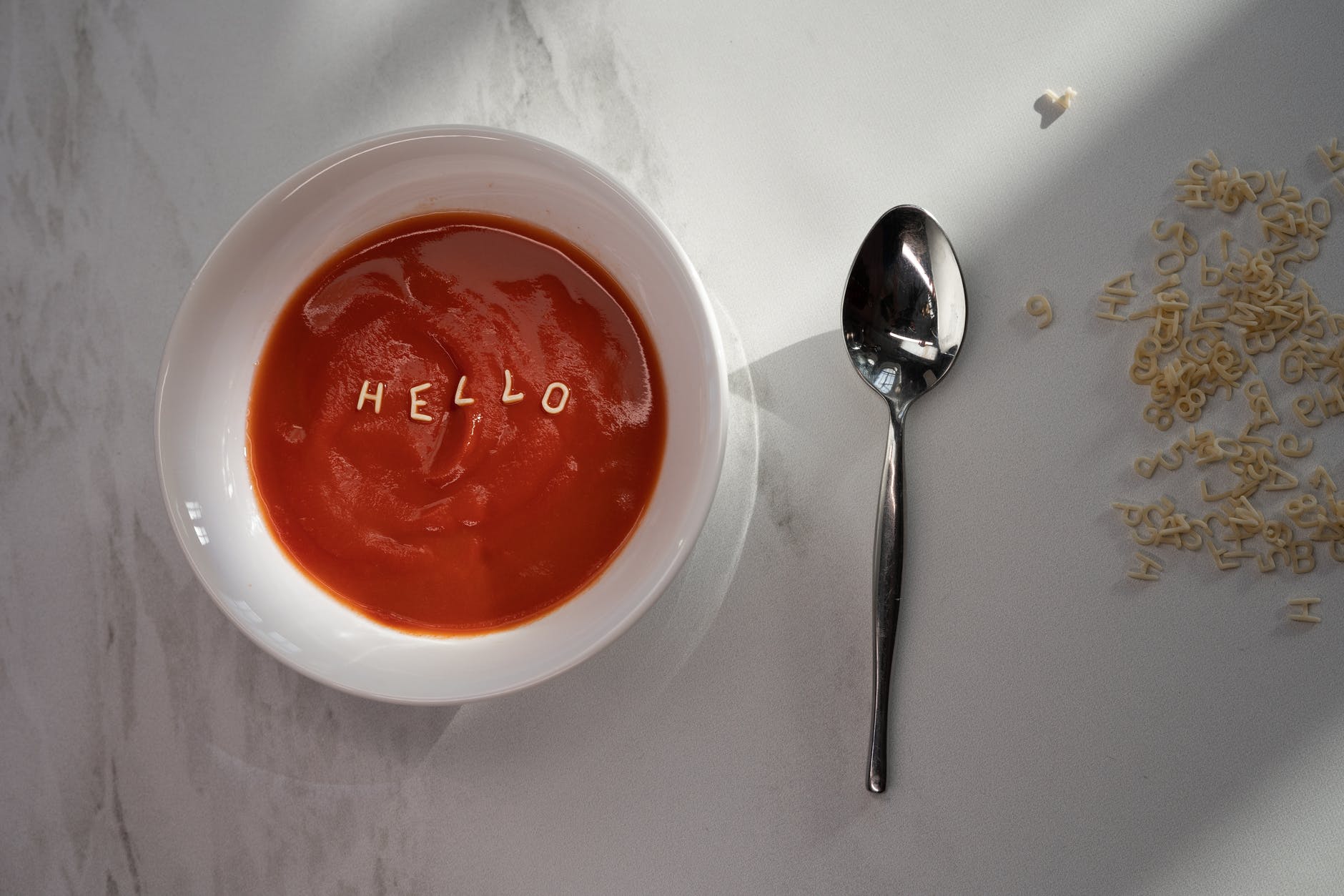 red sauce in white ceramic bowl