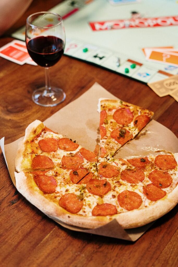pepperoni pizza on wooden surface