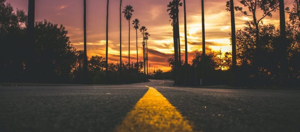 road in city during sunset