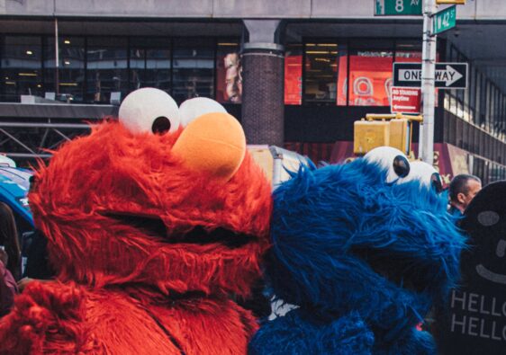 elmo and cookie monster mascots