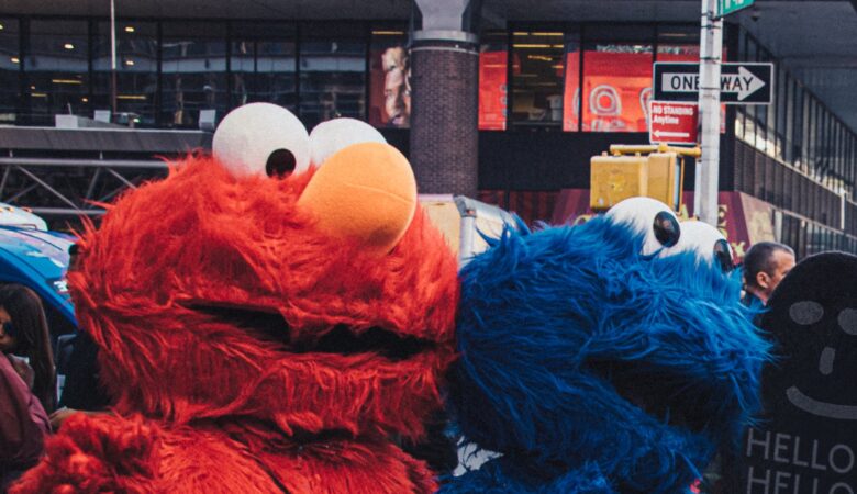 elmo and cookie monster mascots