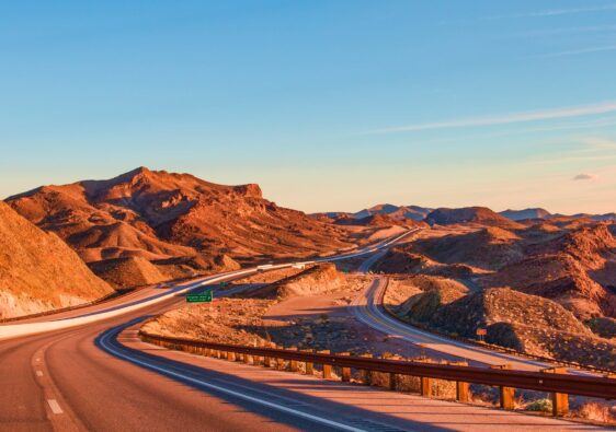 landscape photography of rock formation near highway