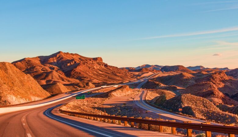 landscape photography of rock formation near highway