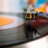 retro turntable playing vinyl disc in living room
