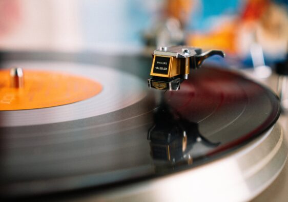 retro turntable playing vinyl disc in living room